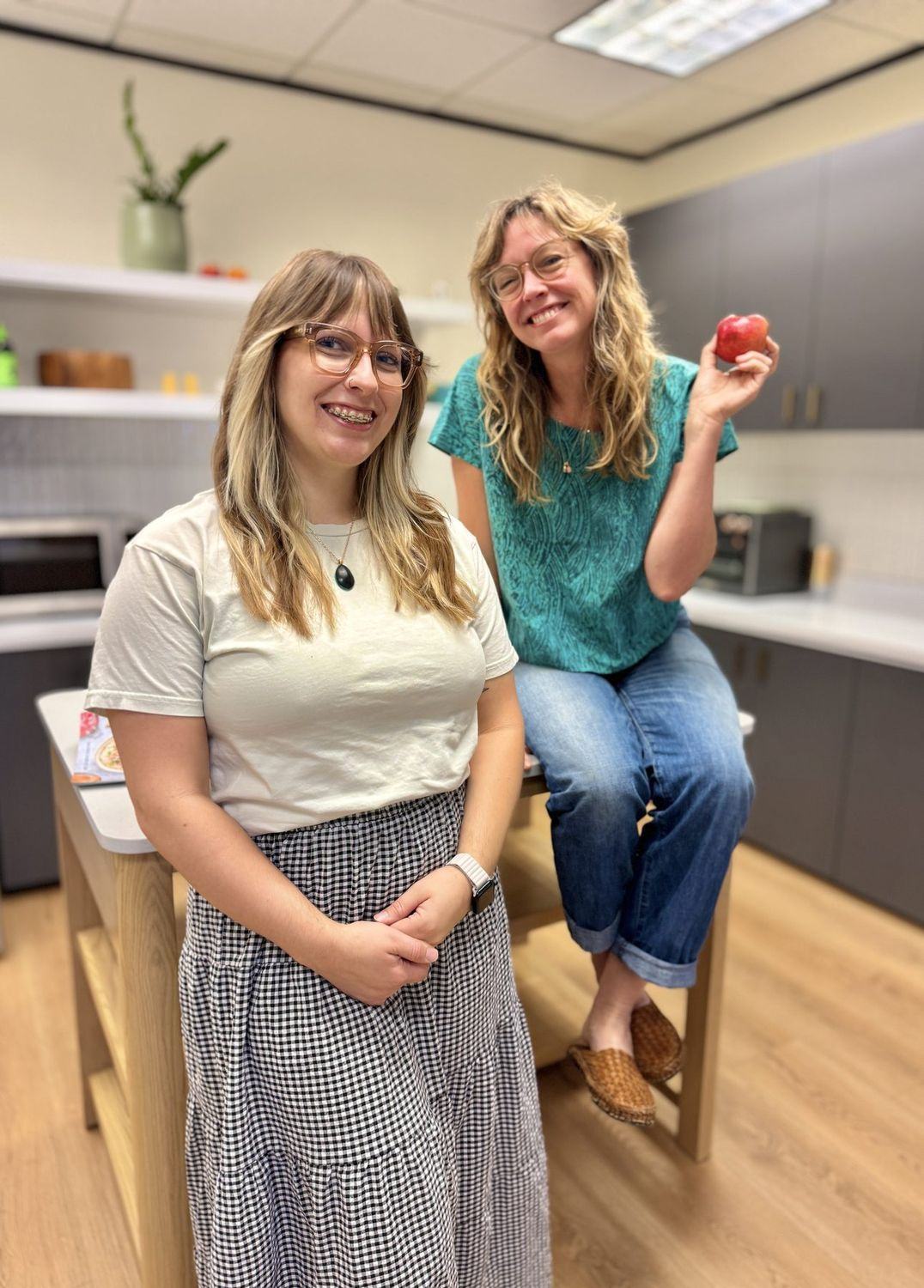 Two dietitians from the Empowered Treatment team in the center's kitchen in Austin, where supported meals happen