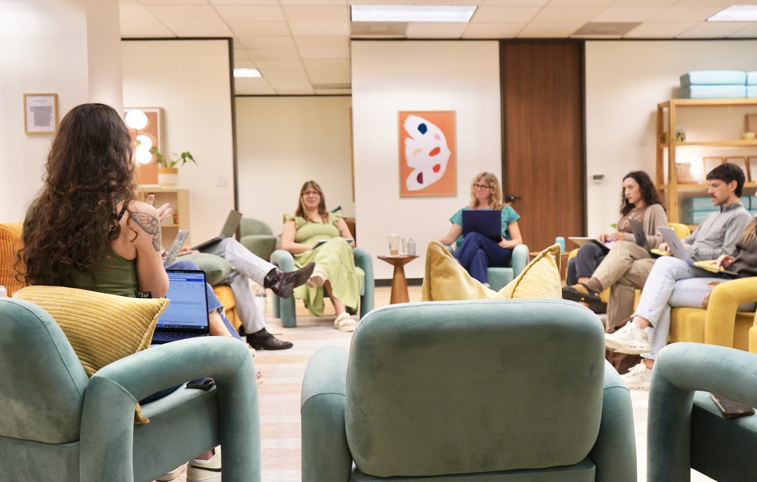 The clinical team at Empowered Treatment meeting together in the group room in Austin