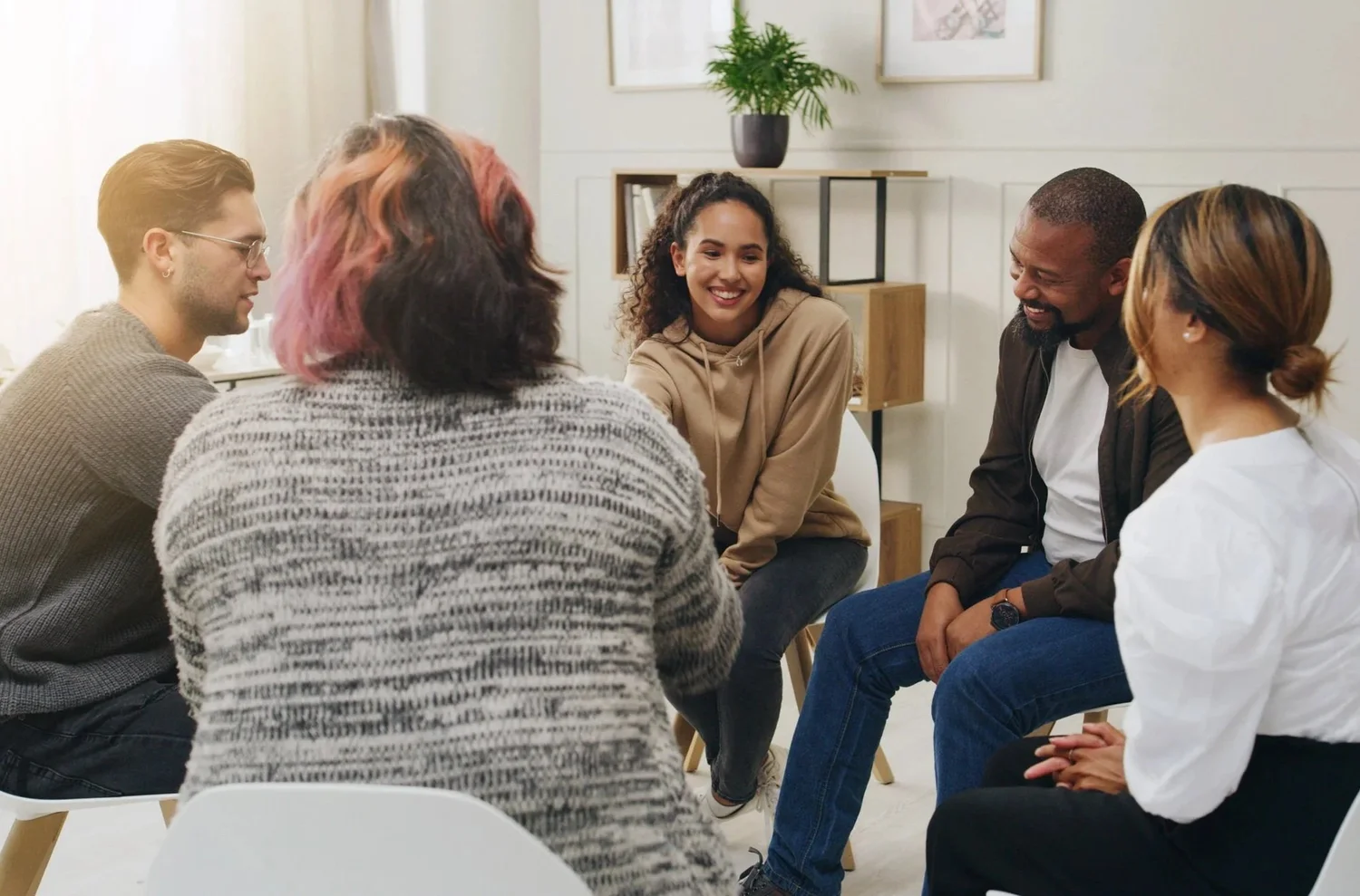 A diverse group of people talking.