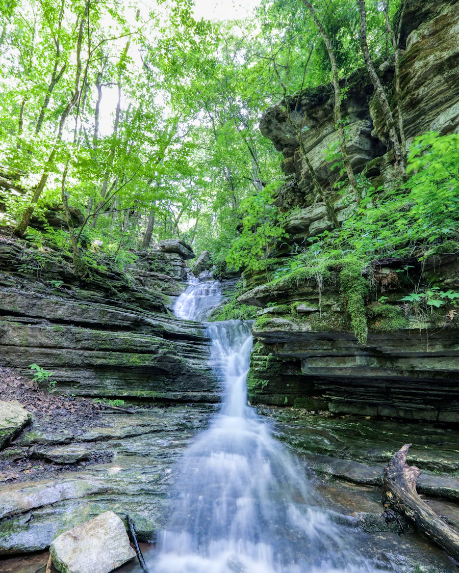 A waterfall spilling over layered rock at Blanchard Springs, Arkansas