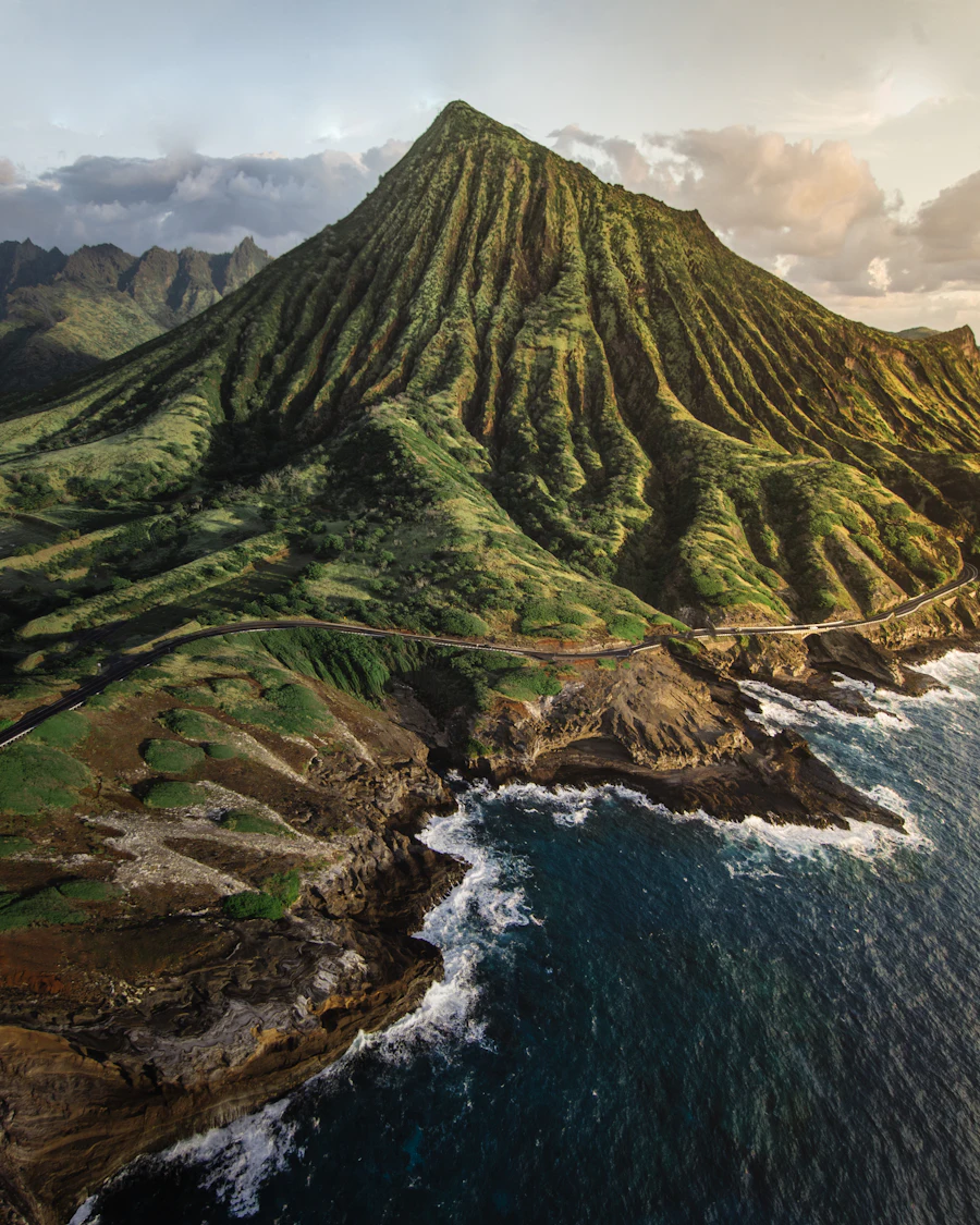 A green volcanic ridge above the ocean on Oahu, Hawaii