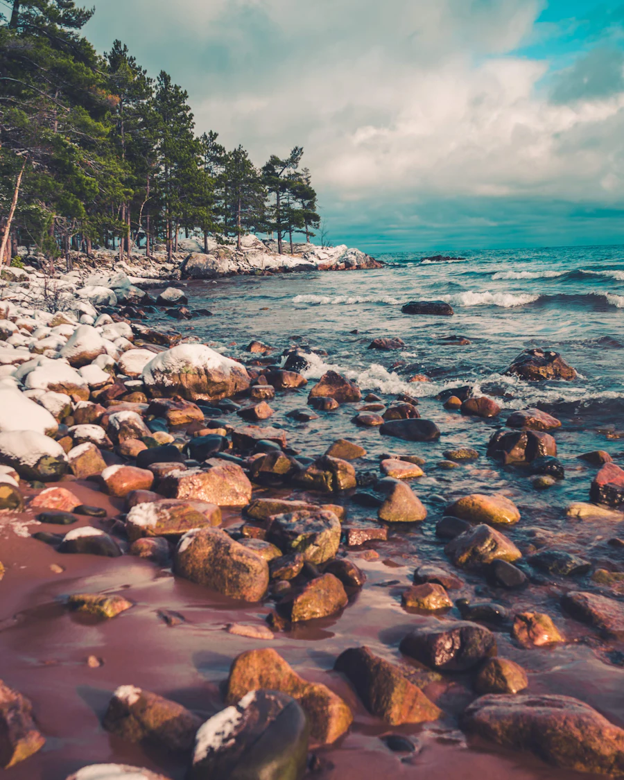 Clear water over smooth stones on the Lake Superior shore near Marquette, Michigan